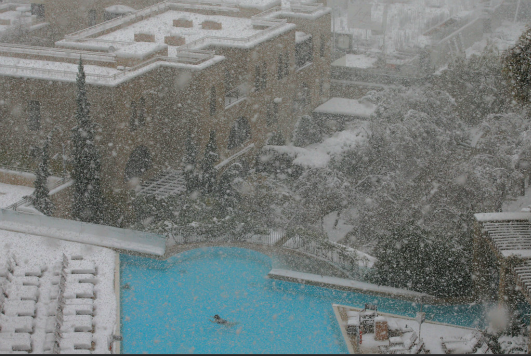 A lone swimmer in the pool at the David Citadel Hotel in Jerusalem (Photo by Brian Snyder/Reuters via Lens)