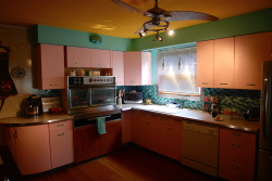 dannybrito:  midcenturymodernfreak:  Atomic style Geneva Kitchen Cabinets in pink featuring a c.1960 Frigidaire Flair Electric Range/Oven! - Via  crying actual tears, perfect kitchen 