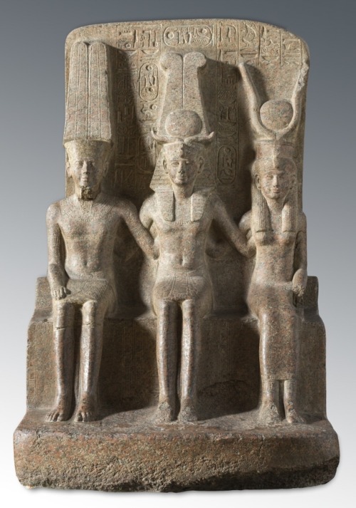 Triad of Ramesses II with Amun and MutPink granite statue depicting Ramesses II seated between the g
