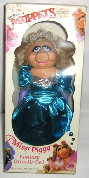 In 1989, Direct Connect produced a set of “Miss Piggy Fantasy Dress-up” dolls. The fashi