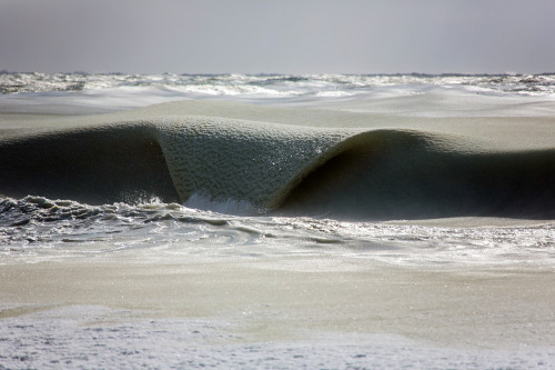 itscolossal:Giant Frozen Waves Infused with Ice Slowly Roll in off the Coast of Nantucket