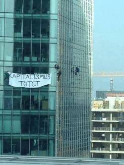 goatvomitdrinker:  Protesters climbed a skyscraper at the Blockupy protest in Frankfurt with a banner that says “Capitalism Kills” 