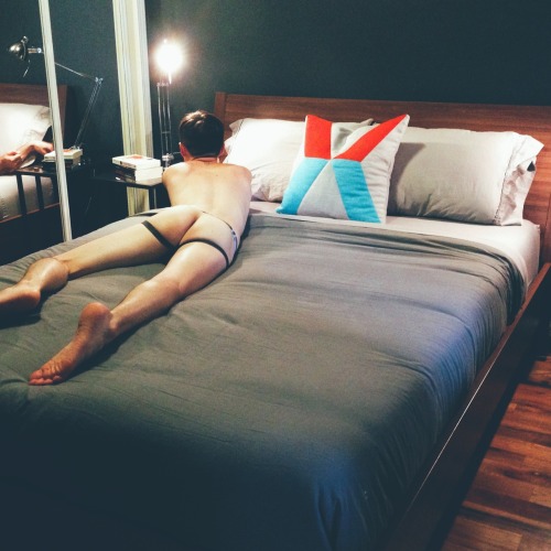 postpornpostoffice:  we redid our bedroom this weekend—new bed frame, linens and paint. two days later and after all the tiresome labor, I stripped down to my favorite jockstrap and crawled onto the bed, begging to be taken advantage of. 