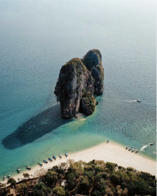 Dappled in the sun here is the famous Railay beach of Krabi. West-facing and always amazing at sundo