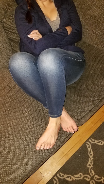My pretty wife candid on the couch watching t.v bare footed.please comment