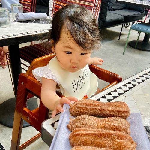 Taking after mommy! #churros #desserts #baby #babygirl #mommyandme #momlife #9monthsold #hungrybaby 