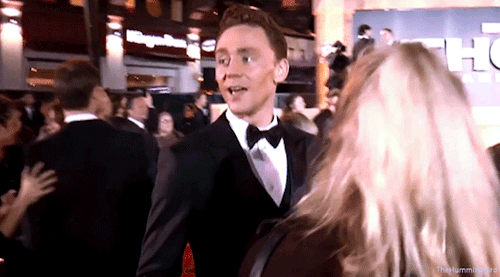 Tom Hiddleston having fun on the red carpet at the World Premiere of Thor: The Dark World in London,