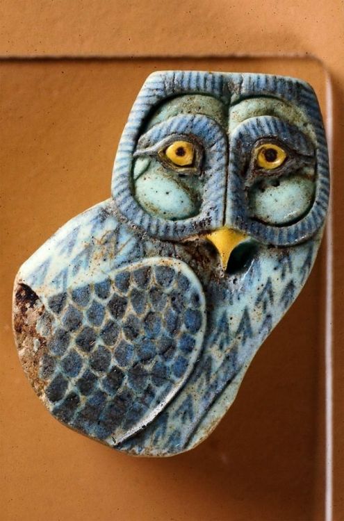 egypt-museum:Inlay in the form of an OwlTop part of a an owl hieroglyph in a hard faience with polyc