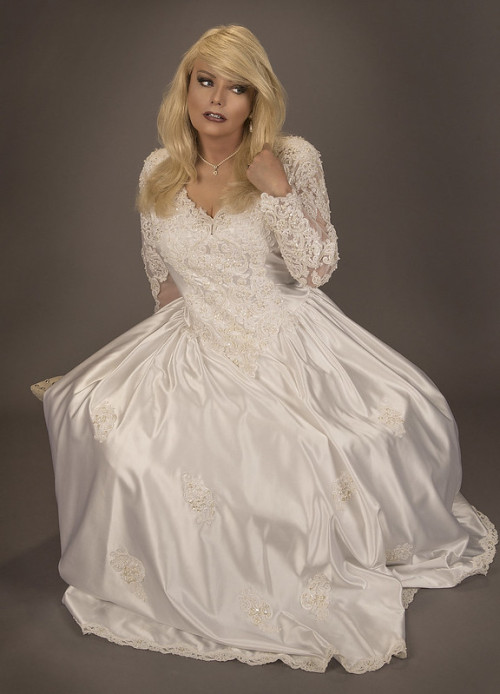 This crossdressing bride is Amanda, taken at her business, True Colors.