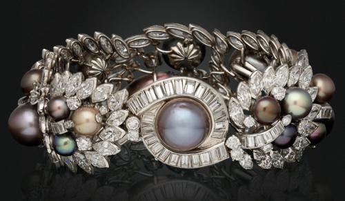 A natural pearl and diamond bracelet,1953, signed Cartier, LondonDrop, button and baroque-shaped gra