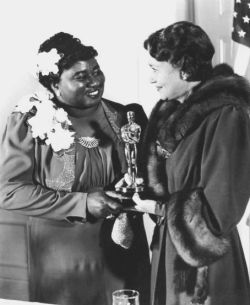 wehadfacesthen:  Hattie McDaniel receiving her Oscar for Gone With the Wind from Fay Bainter, February 1940. She was the first African-American to win an Academy Award. 