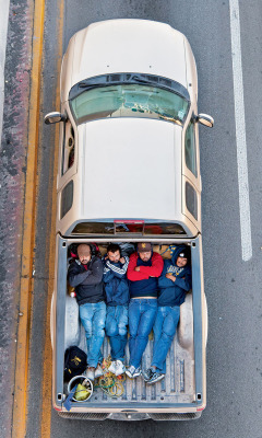 likeafieldmouse:  Alejandro Cartagena - The Car Poolers (2012) “A bridge is situated on a highway that goes from the Mexican city of Nuevo Laredo — across the United States border in Laredo, Texas — due south to Monterrey. In the winter early-morning