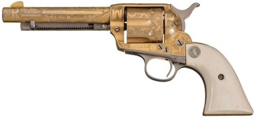 Gold plated and Cattle Brand engraved Colt Single Action Army with carved ivory grips. Manufactured 
