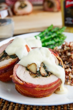 foodffs:  Bacon Wrapped, Mushroom and Spinach Stuffed Pork Tenderloin in a Creamy Dijon Goat Cheese SauceReally nice recipes. Every hour.Show me what you cooked!