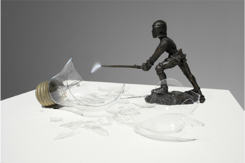 unicorn-meat-is-too-mainstream:  Overpower is a creative little sculpture that portrays a battle between a Medieval knight and a modern lightbulb. Created by artist Michel de Broin, the small bronze statue is mid-swing with a sword that seems to have