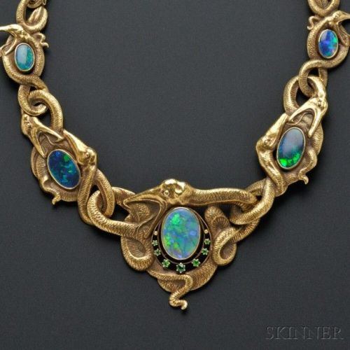 coolthingoftheday:A serpentine Art Nouveau 18 karat gold, opal, and demantoid garnet necklace from t