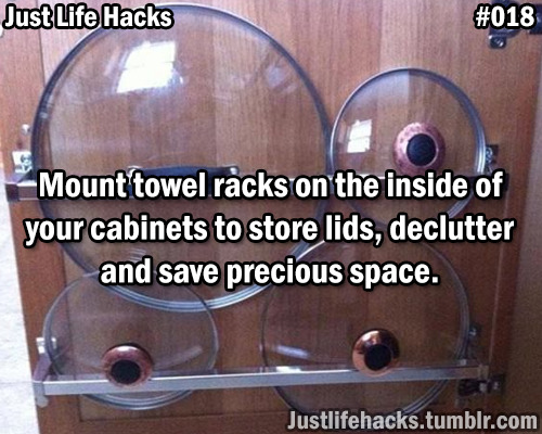 Mount towel racks on the inside of your cabinets to store lids, declutter and save precious space.