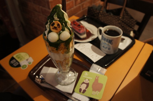 rorainjapan:  Takadanobaba’s Shirokuma Cafe This place is adorable!! On the weekends, they charge an extra 200 yen for playing the anime on HD screens. I got the Panda-kun Parfait which was vanilla ice cream, matcha, azuki, and cereal for 690 yen. It