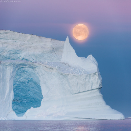 sixpenceee: Moonrise over Scoresby iceburgs. Photography by Daniel Korden.