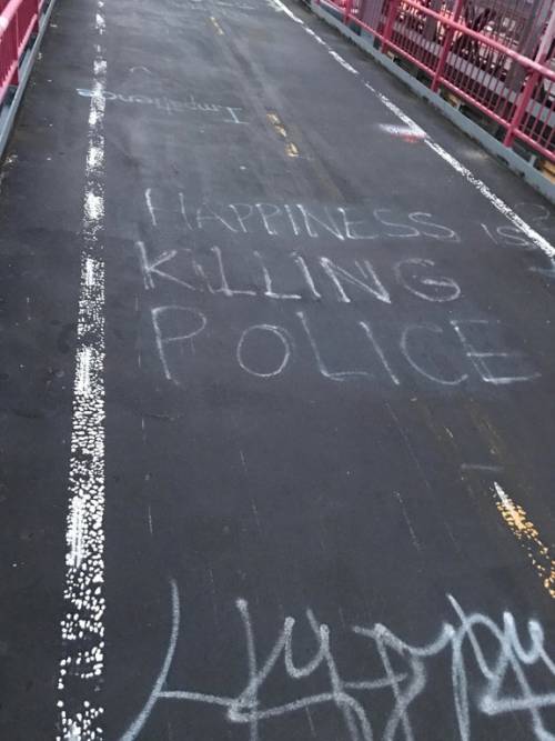 Anti-cop graffiti seen on the Williamsburg Bridge in NYC