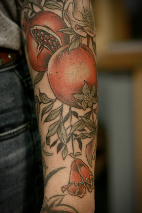 kirstenmakestattoos:  Pomegranates, little pomegranate flowers and hellebore for Katina. I have the best clients in the entire world. One shot on a tough tough lady! I love tattooing fruit.