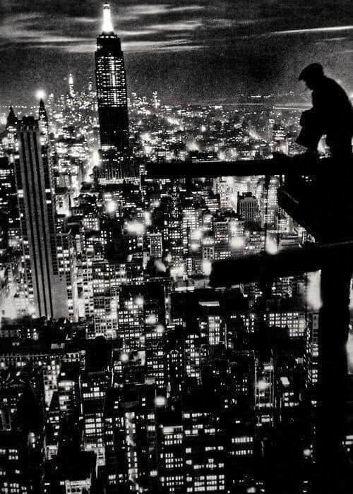 High above a bustling New York City, 1932.