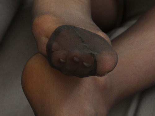 Feet in black stockings