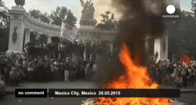 kropotkindersurprise:  26 may 2015 - Protesters tear down and burn election posters in Mexico city during a march to mark the 8th month since the disappearance of 43 students. [video]