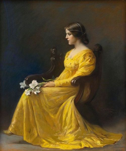 Woman seated, holding lilies (1902) by James Wells Champney (USA, 1843-1903).
