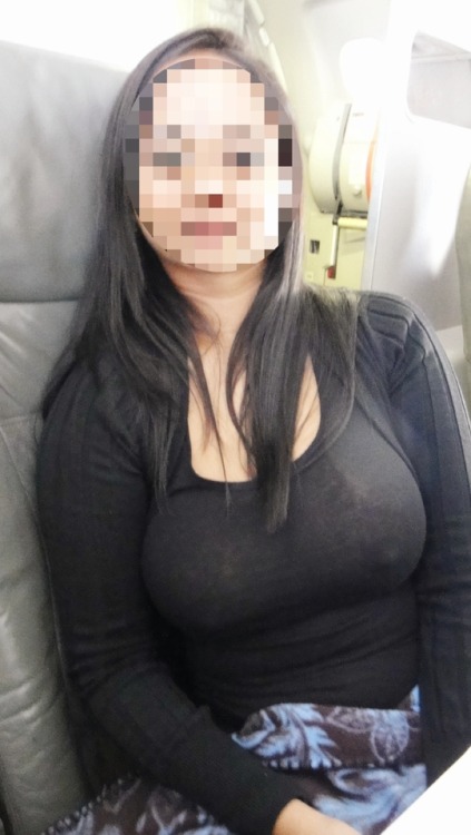 Porn Pics look-here00:  Braless on the plane!