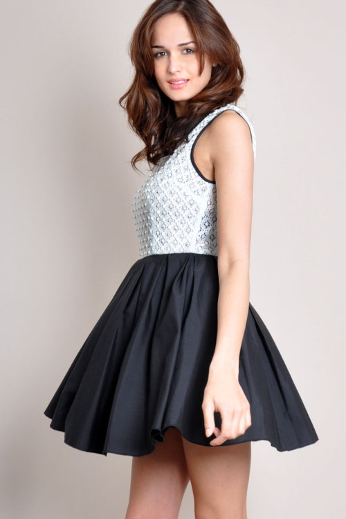 TFNC prom style dress with hand embellishment on a crochet style top. Full body skirt and concealed 