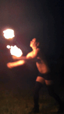 rubberdoll:  me doing my fire poi 