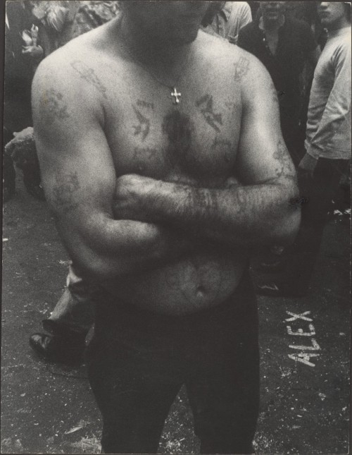 Shirtless, Tattooed Man with Arms Folded, on Street, New YorkLeon Levinstein (American; 1910–1988)19