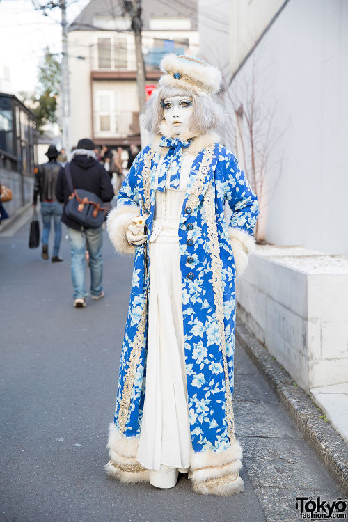 Japanese shironuri artist Minori on the street in Harajuku wearing a blue and white outfit with faux