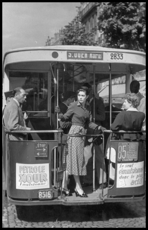 A woman photographed on her daily commute on one of the city’s buses. Paris, France; 1951