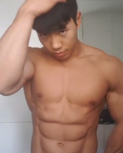janicelondon2:  Been awhile since I saw an Asian who’s cute and hot at the same time. Check out his pecs, those big, muscular arms, that smooth, flawless face and the way he stares right into you as though he knows you’re mentally sucking him off!