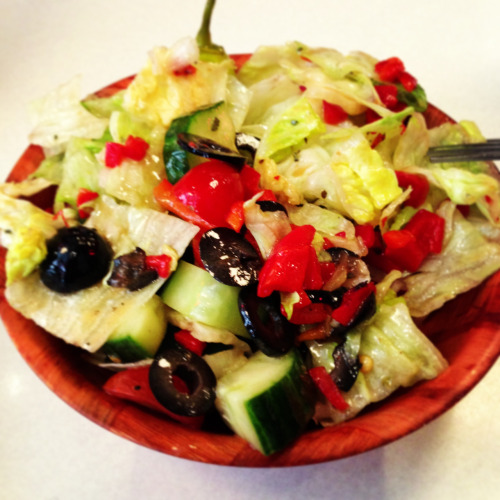 The Sunday Salad: romaine. Iceberg, cucumber, tomatoes, olives, red peppers. Dressing of olive oil, red wine vinegar, oregano. Perfection!