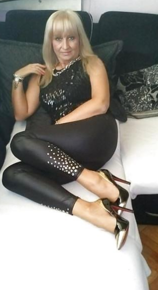 Hot granny in shiny leggings and high heels stilettoshttp://www.lustfuldates.com