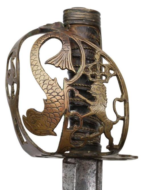 French saber with lion/seadragon hilt, circa 1789-1796.from Helios Auctions
