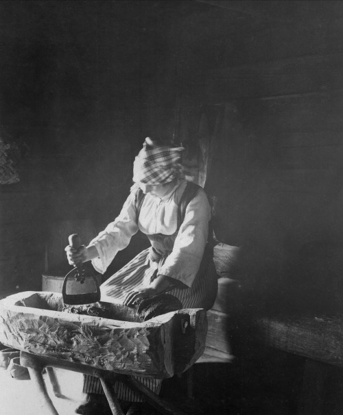 Nils Keyland.  Sausage production. Mincing of meat in wooden ho, 1919.  