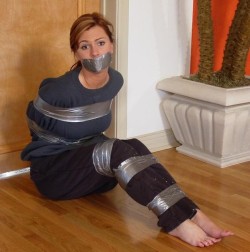 blackice210:  boundsilence:  Taped up house wife   Gorgeous normal housewife