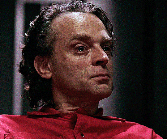 gif 2 of 6. a man, a convict in an orange jumpsuit named Luther Boggs, receives the piece of cloth.