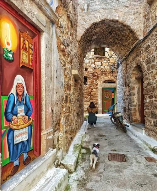 Taking photos in an alley in Olympi, Chios, Greece. Photo by popigeo1.