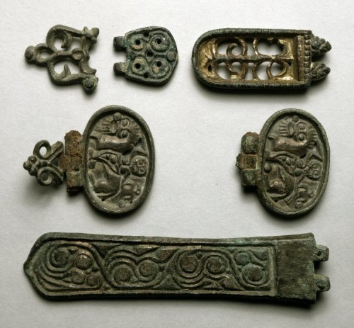 artofthedarkages: Buckles, hinges, and fittings with openwork and incised designs of swirls, plants,