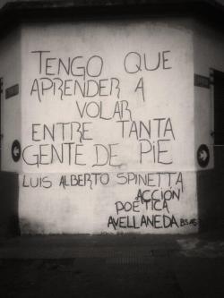 unnuevouniverso:  Tengo que aprender a volar entre tanta gente de pie. Luis Alberto Spinetta. Acción poética Avellaneda, Buenos Aires. 