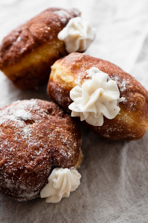 sweetoothgirl:  Apple Pie Cream Filled Pumpkin Doughnuts