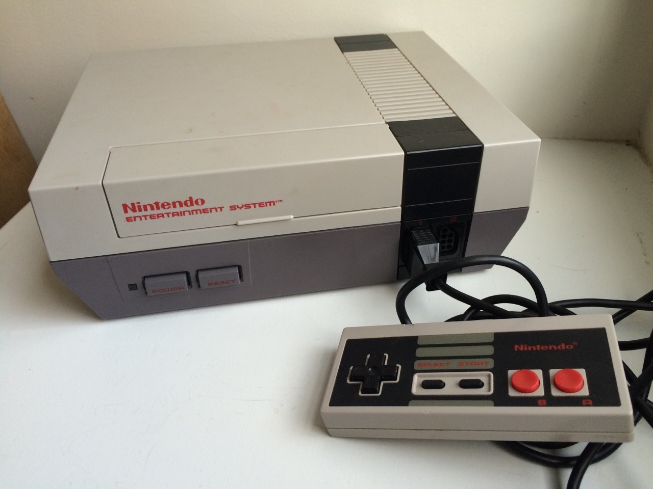 Does the internet need another pic of the venerable NES? I dunno, but I found mine in a box from the basement, so here we are. Not even very yellow! I lucked out (and also it hasn’t been in the light much).
Also dug up most of the NES and SNES carts...