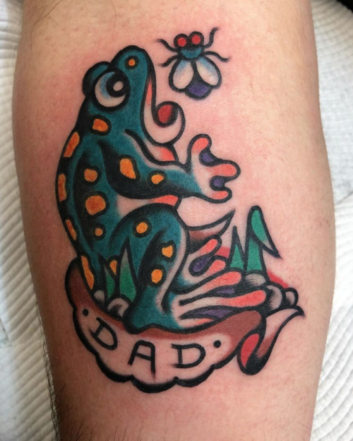 Traditional style frog tattoo on the tricep.