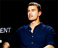 divergents:  Theo James + playing with his shirt 