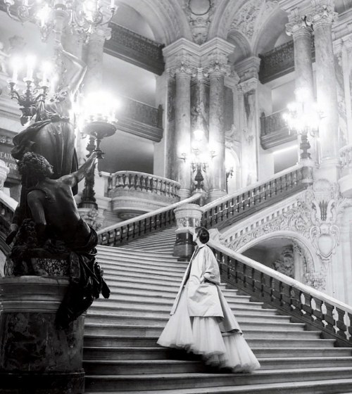 Wenda Rogerson with sculpture on the staircase at the Paris Opera, February 1948. Photograph by Clif